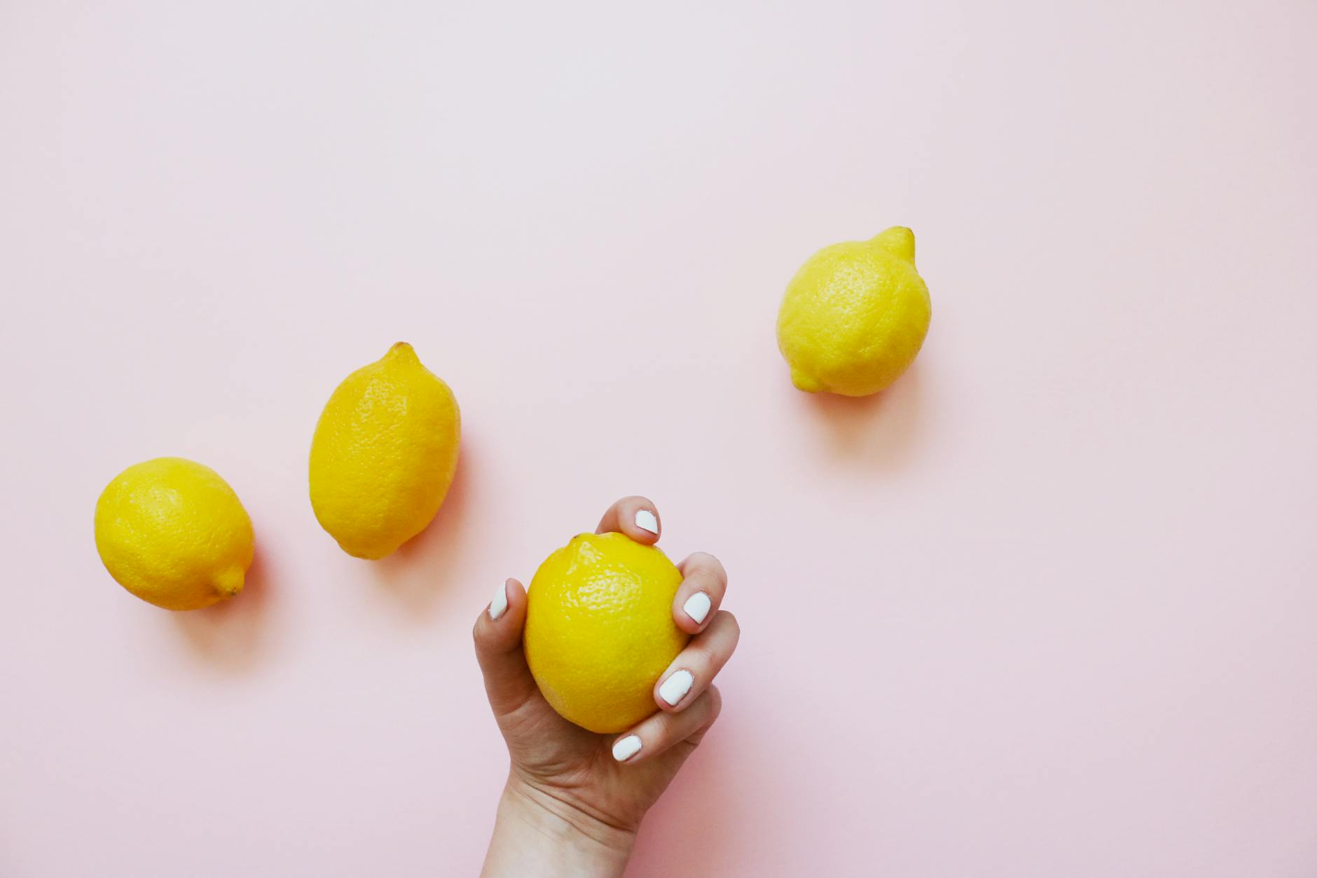A yellow silicone vibrator surrounded by peeled bananas on a bright yellow background, symbolizing gentle, nourishing pleasure