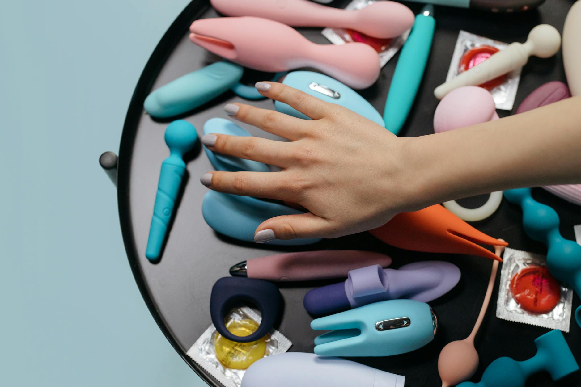 Close-up of hands holding a personal massager, representing comfort and intimacy with clitoral vibrators