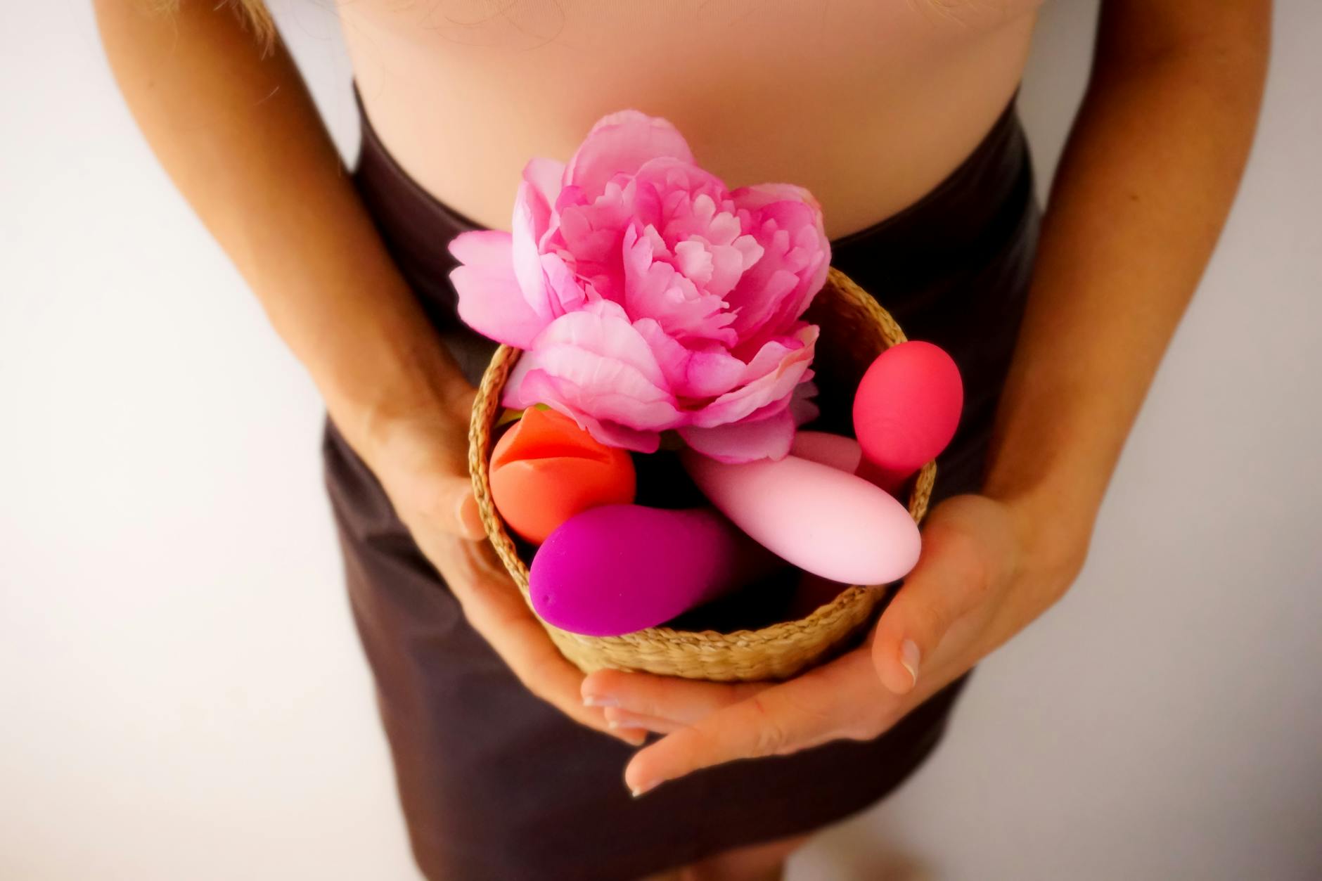 Colorful flowers and objects arranged on bright yellow background, representing vibrant pleasure at any age